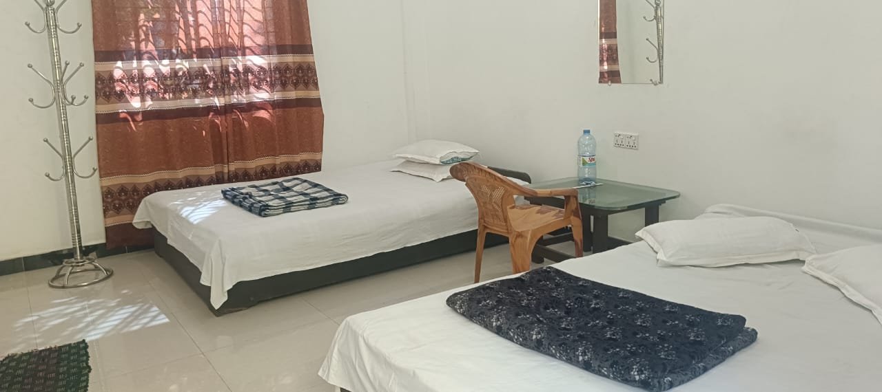 Shahjalal Resort Saint Martin, room 109, Two beds, table and chair